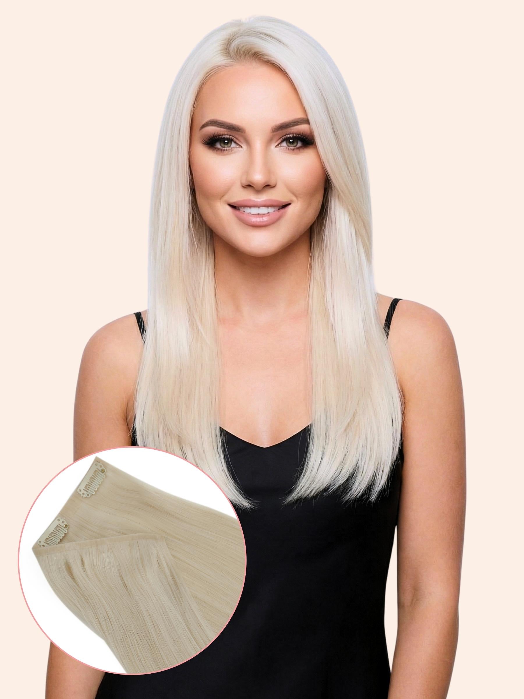 Woman with long blonde hair extensions on a beige background