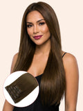 Woman with long brown hair wearing clip-in extensions on a beige background